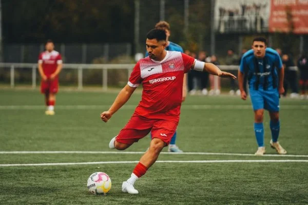 soccer player kicking ball